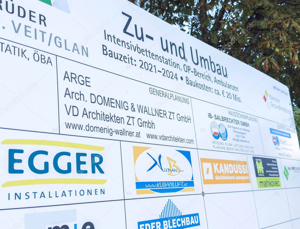 Sankt Veit Ad Glan, Austria - September 17, 2025: Renovation sign at construction site shows project details for intensive care unit, including contractor logos and timeline