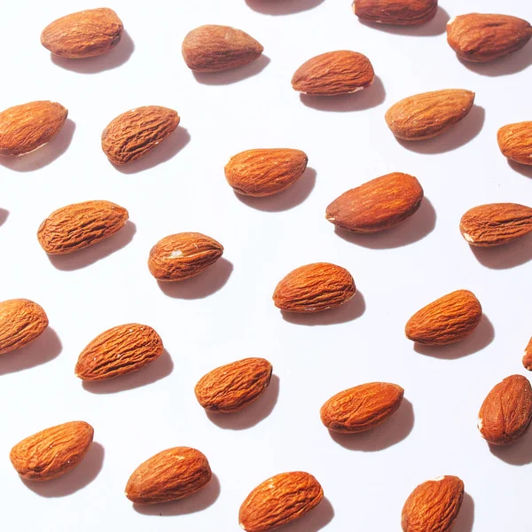 Top view Almond set on white background, Abstract background with Almond pattern. Composition of nuts. Concepts about decoration, healthy eating and food background. Flat lay, top view. Minimal concept.