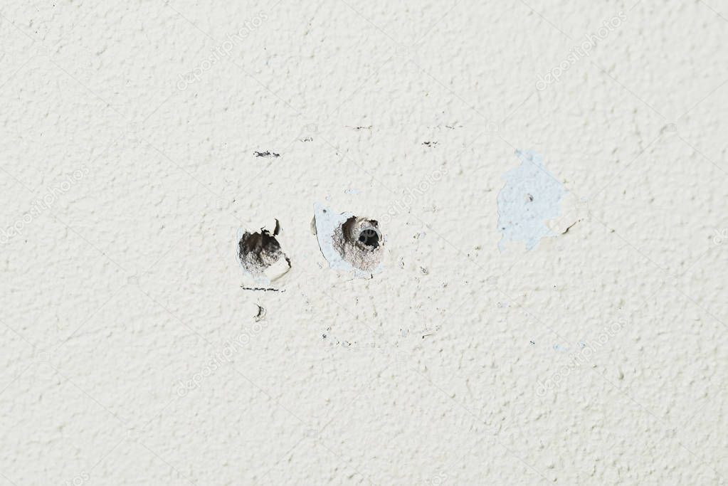 Two holes in the wall foam or aerated concrete for the installation of dowels for bolts.