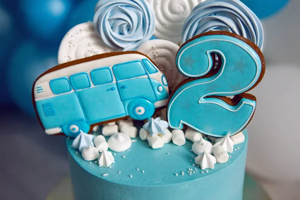 blue cake on childrens birthday with the number two and the car
