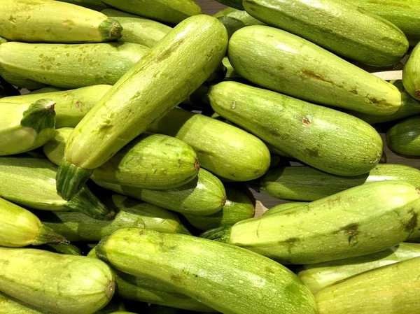 Zucchini. Vegetables. Fragment from a fruit and vegetable shop