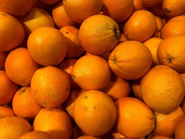 Oranges. Natural fruits, natural vitamins. A living fragment from a fruit and vegetable store.