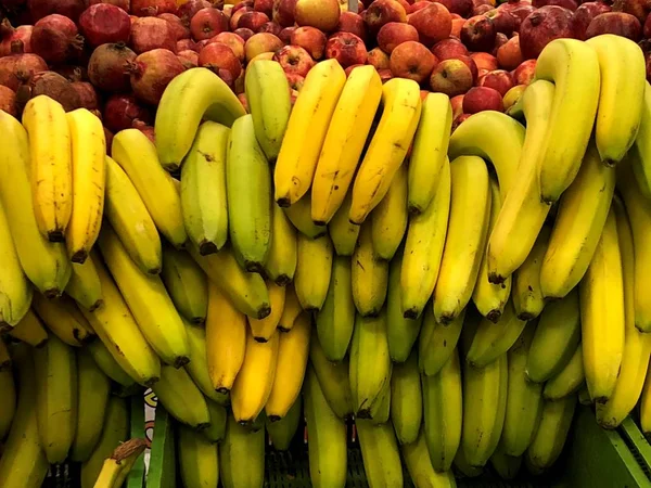 Natural fruits, vegetables, natural vitamins. Bananas. For sale in the market. A living fragment from a fruit and vegetable store.