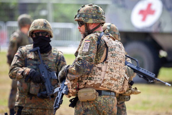 FELDKIRCHEN / GERMANY - JUNE 9, 2018: German soldier instructs soldiers on a open day on day of the Bundeswehr in Feldkirchen