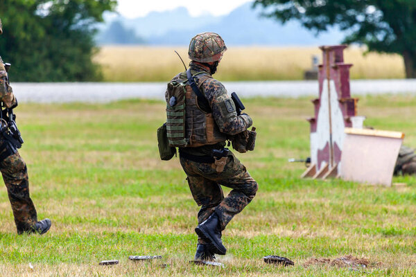 FELDKIRCHEN / GERMANY - JUNE 9, 2018: German soldier on an exercise at open day on day of the Bundeswehr in Feldkirchen