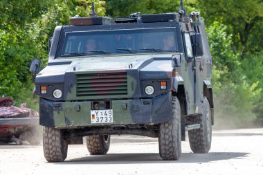 FELDKIRCHEN / GERMANY - JUNE 9, 2018: German armoured personnel carrier MOWAG Eagle, from Bundeswehr, drives on a road at Day of the Bundeswehr. clipart