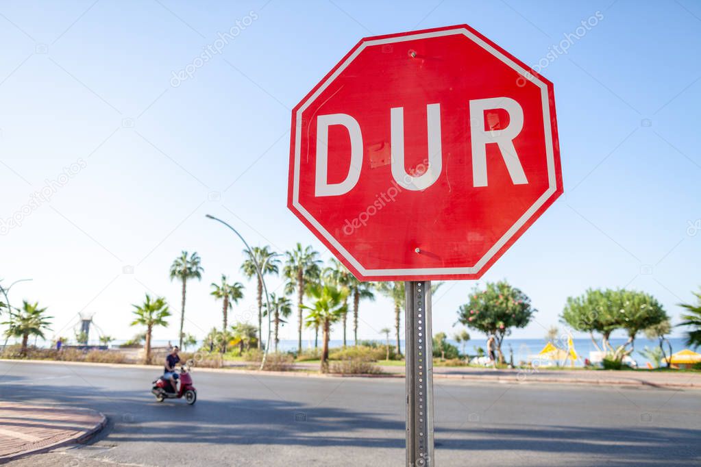 Turkish Stop sign on a street near the beach. DUR is the turkish word for stop.