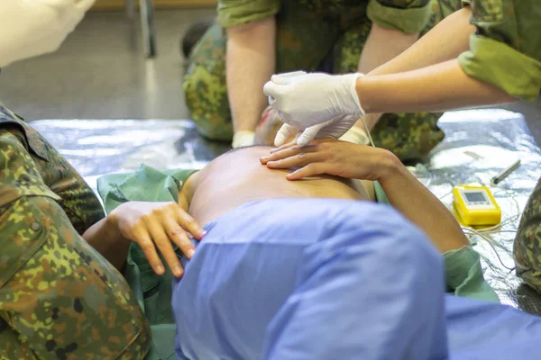 German soldiers practice a medical training with emergency equipment