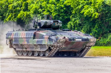 German infantry fighting vehicle drives on a street clipart