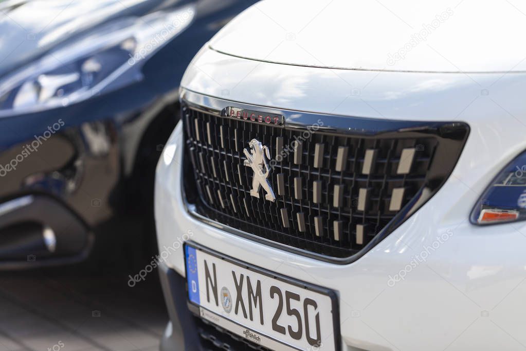 NUREMBERG / GERMANY - APRIL 7, 2019: Peugeot logo on a Peugeot car at a car dealer in Nuremberg.
