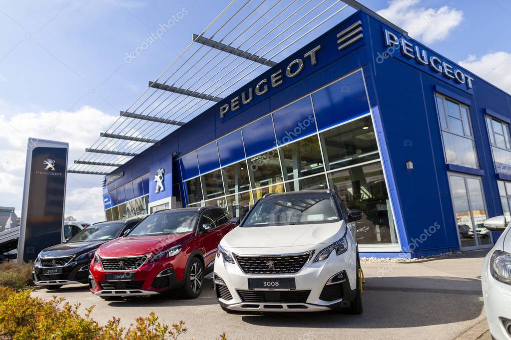 NUREMBERG / GERMANY - APRIL 7, 2019: Peugeot logo on a Peugeot car at a car dealer in Nuremberg.
