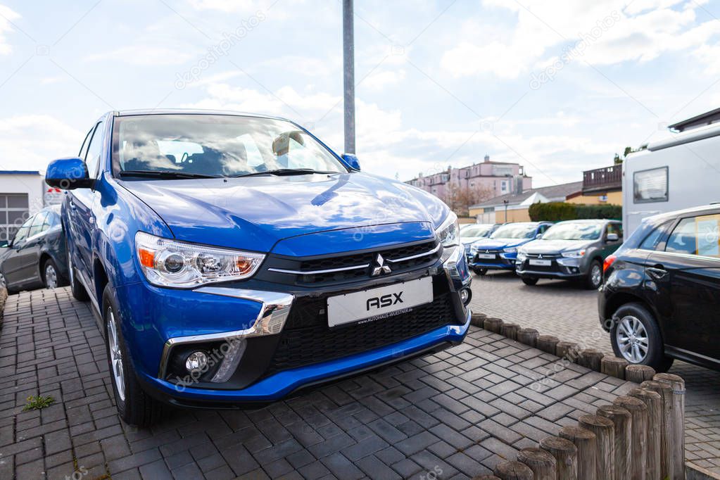NUREMBERG / GERMANY - APRIL 7, 2019: Mitsubishi logo on a Mitsubishi car at a car dealer. Mitsubishi Motors Corporation is a Japanese multinational automotive manufacturer headquartered in Japan.