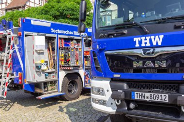 PEINE / GERMANY - JUNE 22, 2019: German technical emergency service trucks stands at public event, Day of the uniform. Technisches Hilfswerk, THW means technical emergency service. clipart