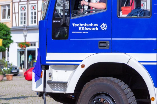 PEINE / GERMANY - JUNE 22, 2019: German technical emergency service trucks stands at public event, Day of the uniform. Technisches Hilfswerk, THW means technical emergency service.