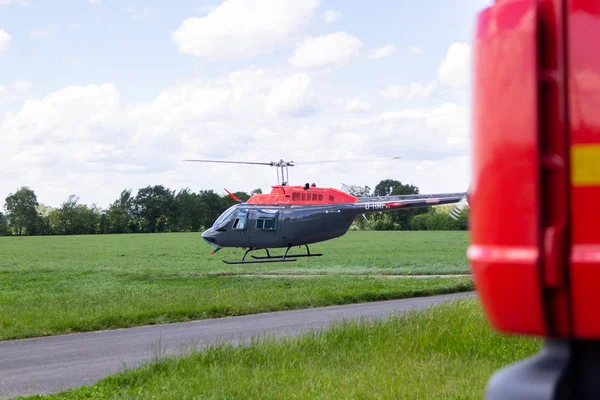 BUECKEBURG / GERMANY - JUNE 13, 2019: Bell 206B JetRanger III flies for military training missions over a helicopter landing zone in Bueckeburg.