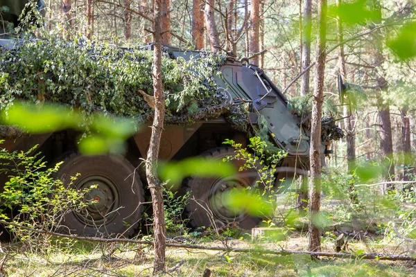 Armoured personnel carrier from german army stands in a military training area