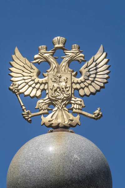Chelyabinsk, Russia - may 26, 2019: Russian coat of arms, two-headed eagle against blue sky