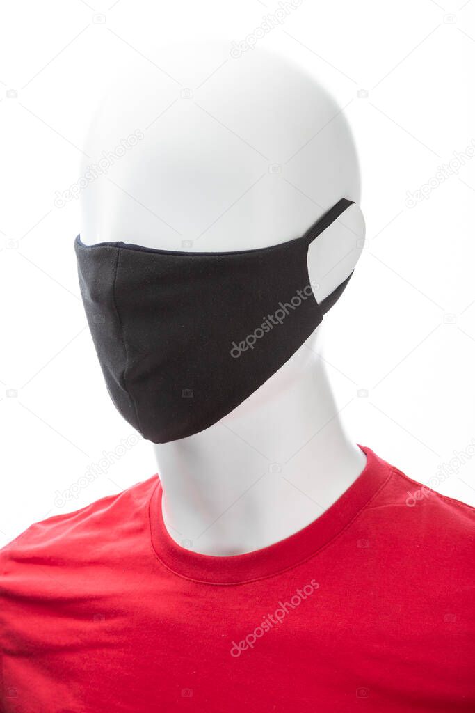 protective face mask against coronavirus on the face of a mannequin, black isolated on a white background