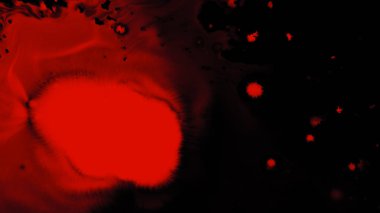 Siyah arka plan üzerinde mürekkep sıçramak