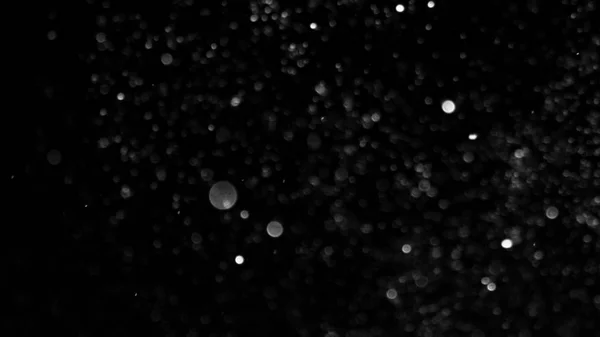 Dust Cloud elszigetelt fekete háttér buborék Bokeh — Stock Fotó