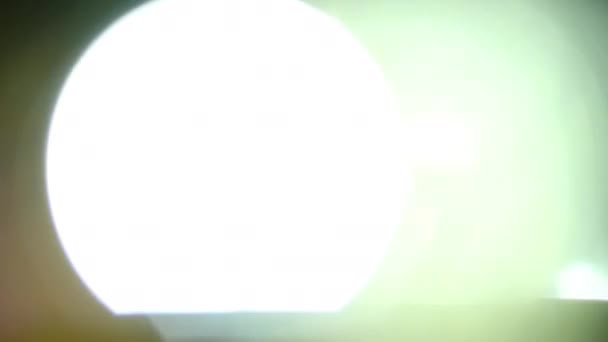 Real Lens Flare Shot in Studio over zwarte achtergrond — Stockvideo