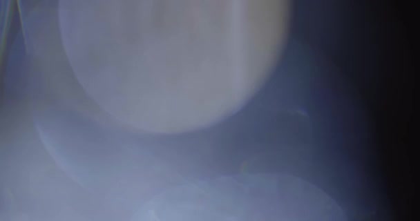 Real Lens Flare Shot a stúdióban felett fekete háttér — Stock videók