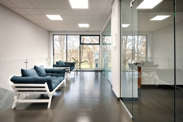 Modern light office room with glass doors — Stock Photo, Image