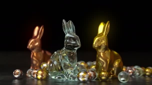 Beautiful copper, glass and golden easter bunny trinkets are standing among plenty of spreading easter eggs on a shiny black floor. There is a space for your text message and logo on top.
