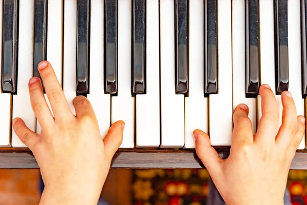 Playing the piano top view.