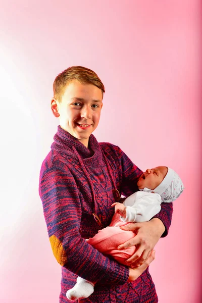 Young Dad Holds Newborn Baby His Arms Studio Pink Background — Stock Photo, Image