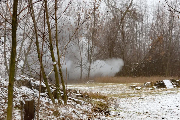 The explosion of anti-tank mines at the site, the smoke in the woods.