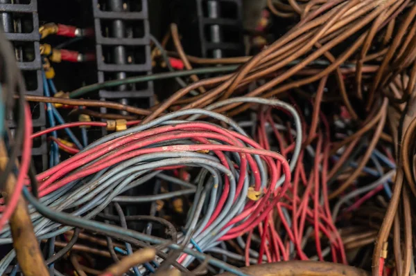 Old multicolored wires in the electrical cabinet of mechanical equipment