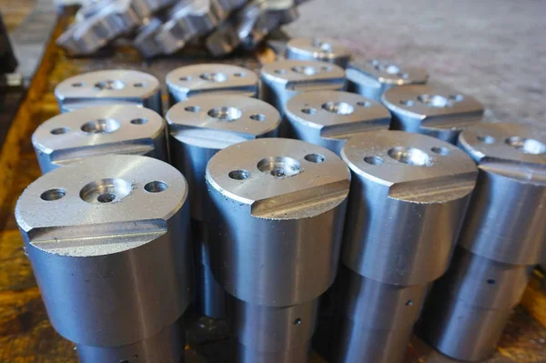 white metal cylindrical parts after machining on the milling and lathe