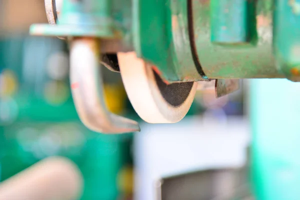 Grinding wheel on the machine close up with blur.