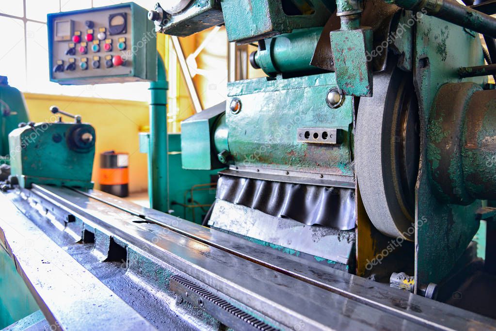 Grinding machine at a machine-building enterprise in a metalworking workshop.