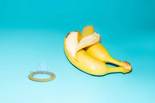 Condoms and two bananas together, the concept of contraceptives and the prevention of venereal diseases of same-sex marriage.