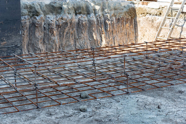 The armature is wired, the foundation of the concrete solution. Concrete foundation for the industrial construction of buildings and structures.