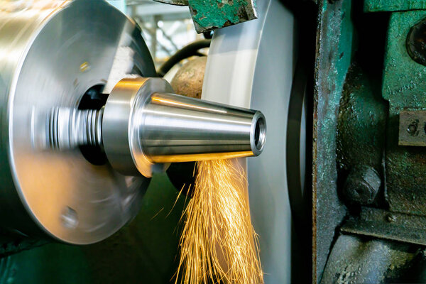 Round grinding of the cone on the machine, industrial industry, engineering production of technological products on an industrial scale.