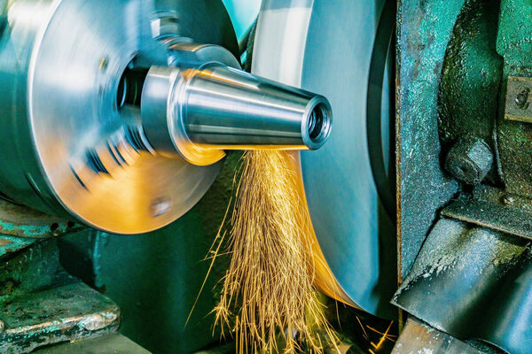 Round grinding of the cone on the machine, industrial industry, engineering production of technological products on an industrial scale.