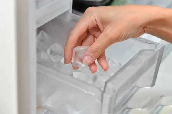 Woman Takes Out Ice Cubes Cool Drinks Ice Maker — Stock Photo, Image