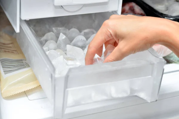 Woman Takes Out Ice Cubes Cool Drinks Ice Maker — Stock Photo, Image