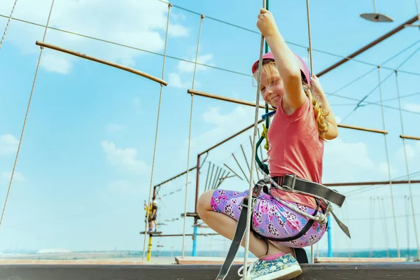 Girl in a sports park amusement extreme park.