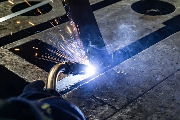 Electric gas welding in the workshop. Sparks from welding.
