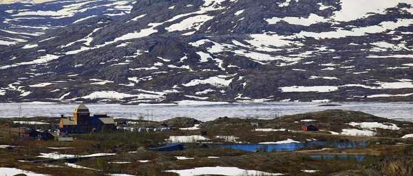 Frozen lake Vassijaure in June, in Northern Sweden
