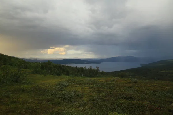 Sun and rain in Blasjofjalls nature reserve near the Wilderness Road in Sweden