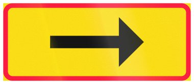 Additional road sign in Finland - Directional arrow.