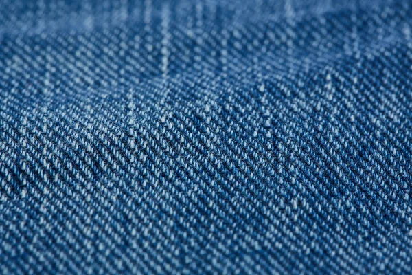 引き裂かれたデニムジーンズのテクスチャの背景 色付きのコットン生地の質感 ステッチのテクスチャジーンズの背景 ファッションジーンズボタン ジーンズにポケットとリベット 繊維構造物 — ストック写真