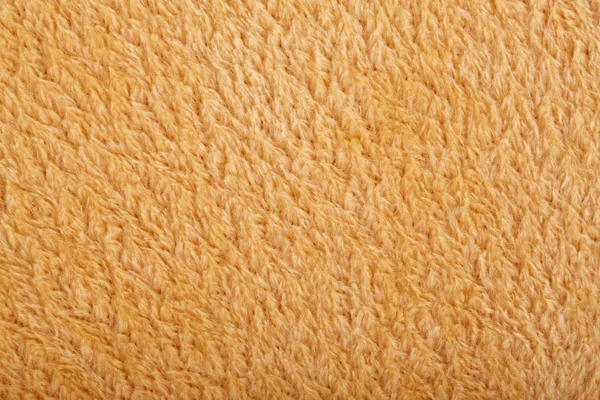 Texture of brown fluffy soft plush. Towel terry cloth, Soft texture cloth