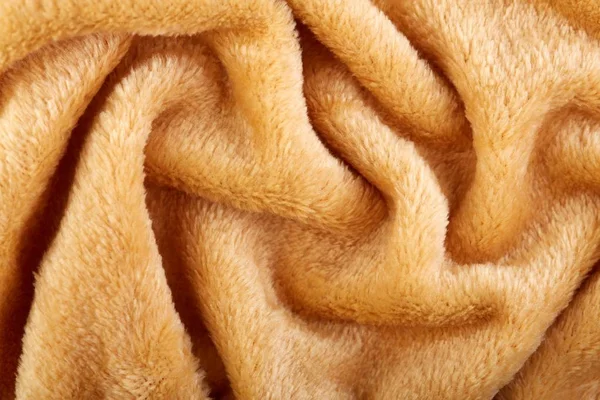 Texture of brown fluffy soft plush. Towel terry cloth, Soft texture cloth