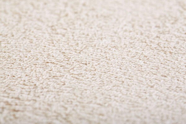fabric and texture concept - close up of a towel terry cloth or terry textile background
